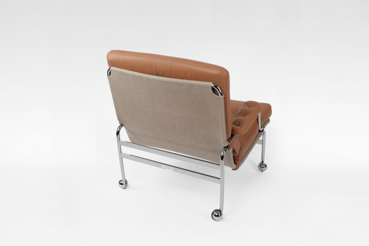 Karin Wheeled Lounge Chair In Cognac Leather & Chrome by Bruno Mathsson for DUX, 1960s